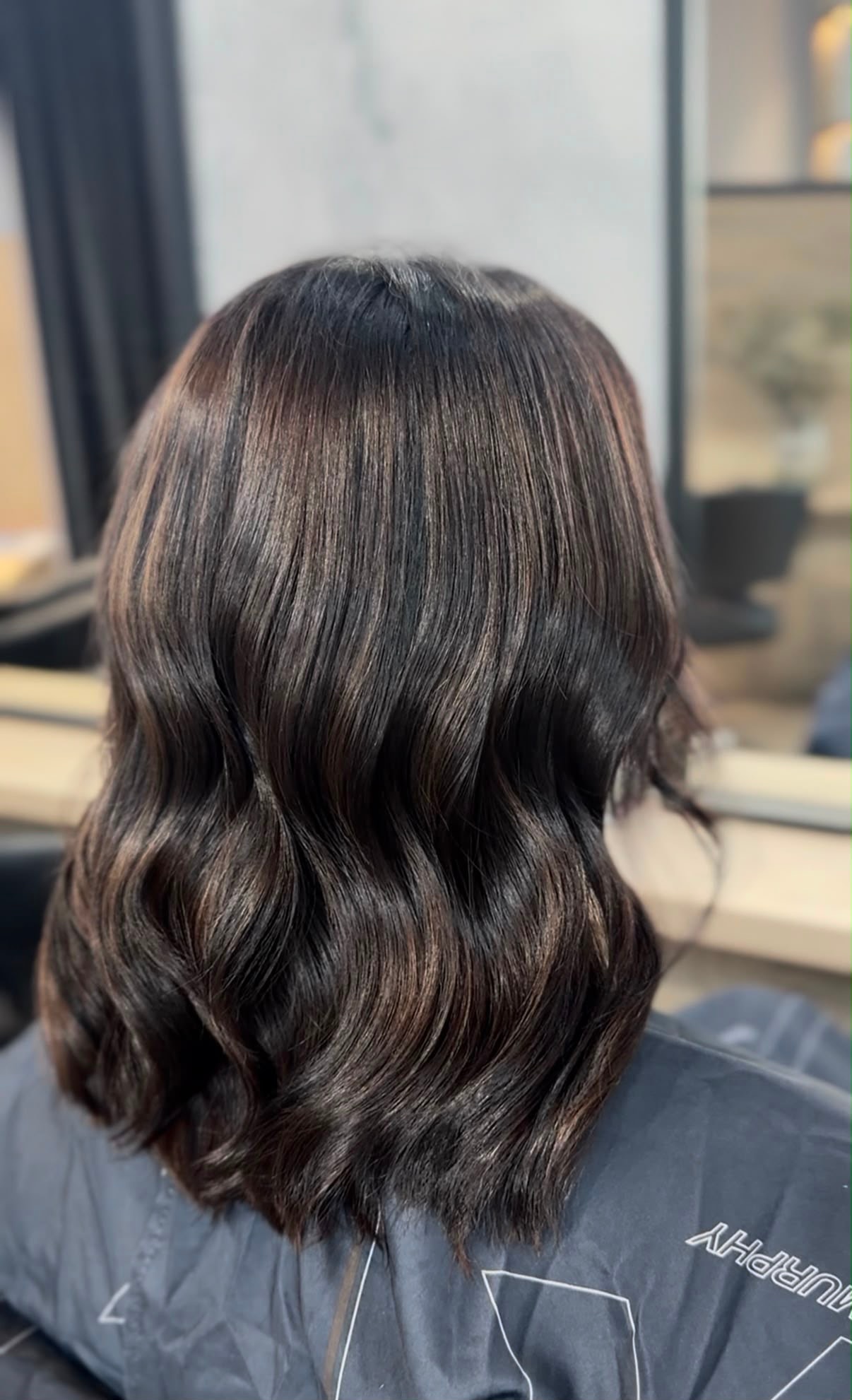 Long dark dimensional bob with movement